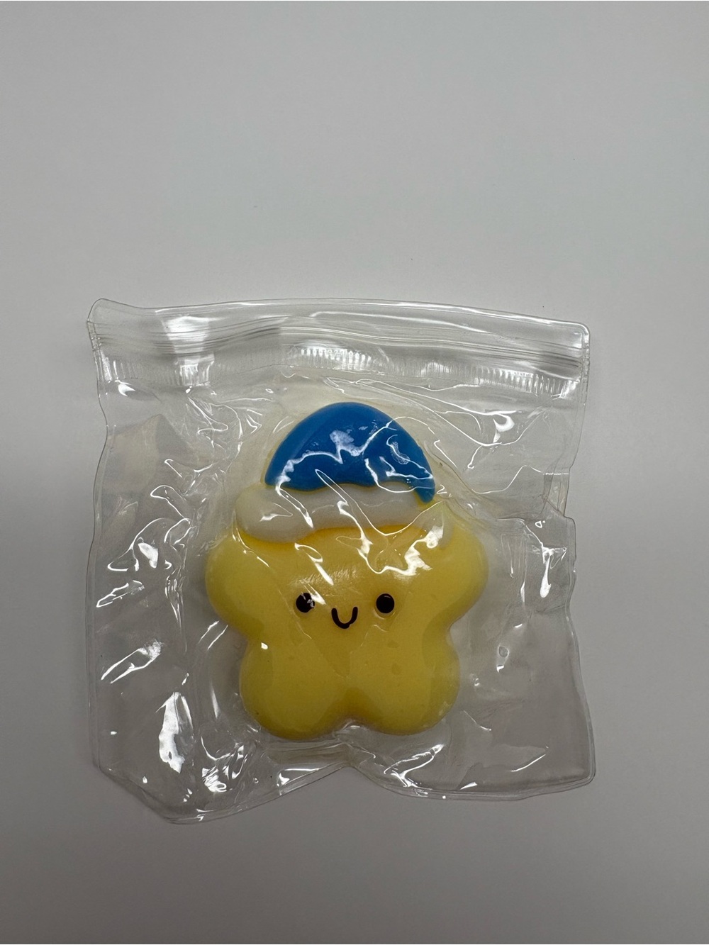Yellow Star Squishy Squeeze Toy with Blue Cap  Yellow Blue